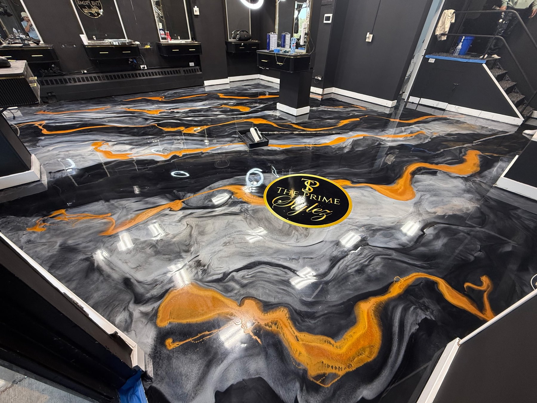 A decorative metallic resin surface with an inlaid medallion