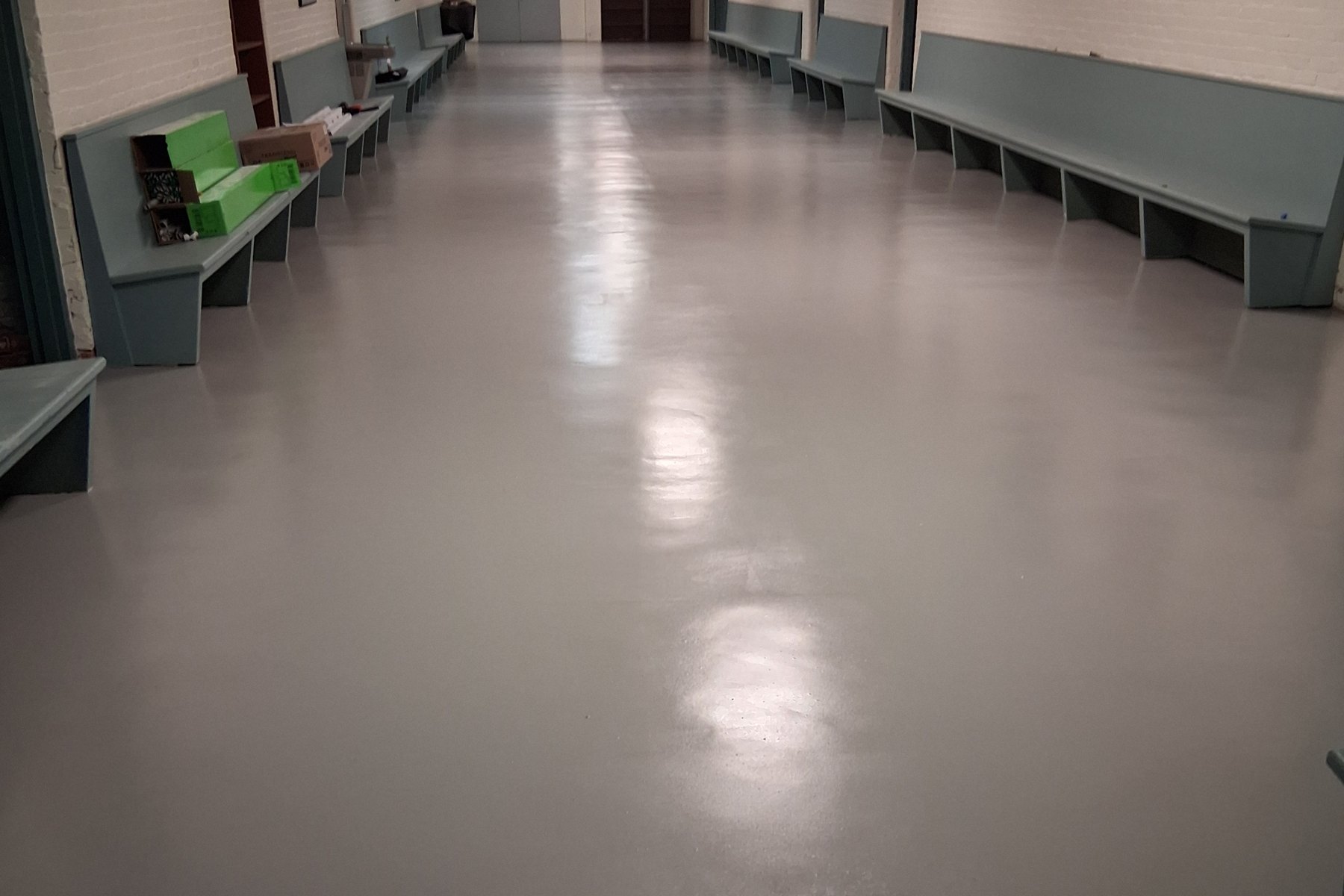 Institutional corridor with a glossy resin floor